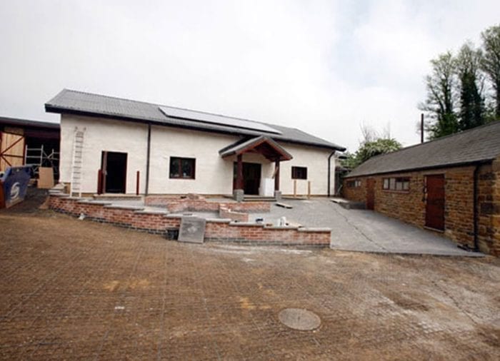 Eco Barn Loddington - installing a biomass boiler, adding low-energy lighting. and installed 16 solar photovoltaic panels